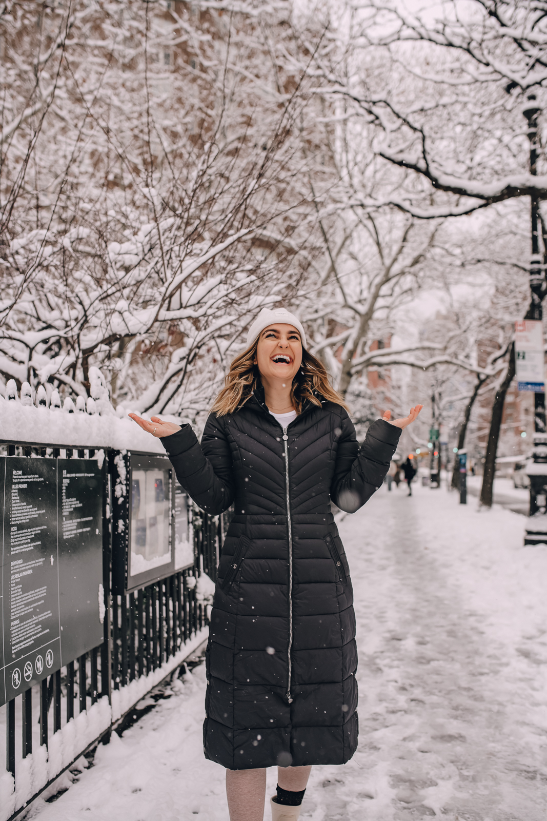 woman smiling while enjoying the snow