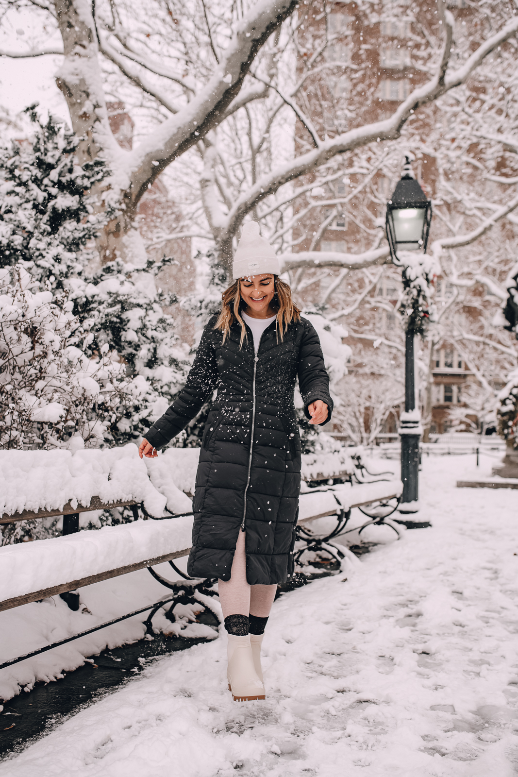 woman kicking snow