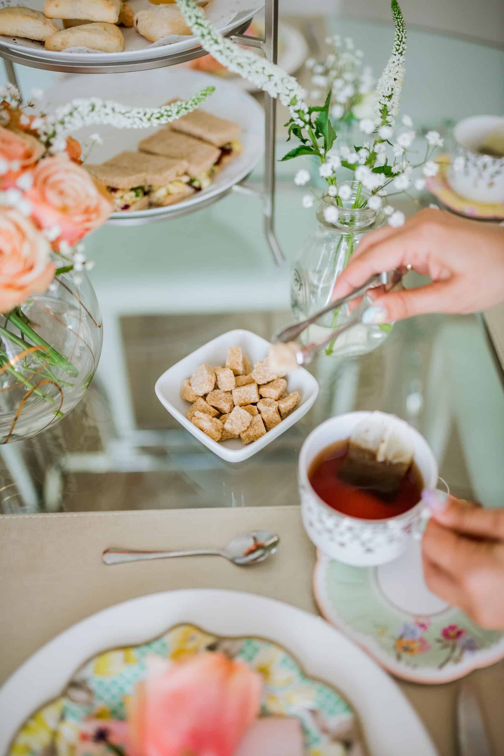 Charmed by Camille adding sugar to her tea 
