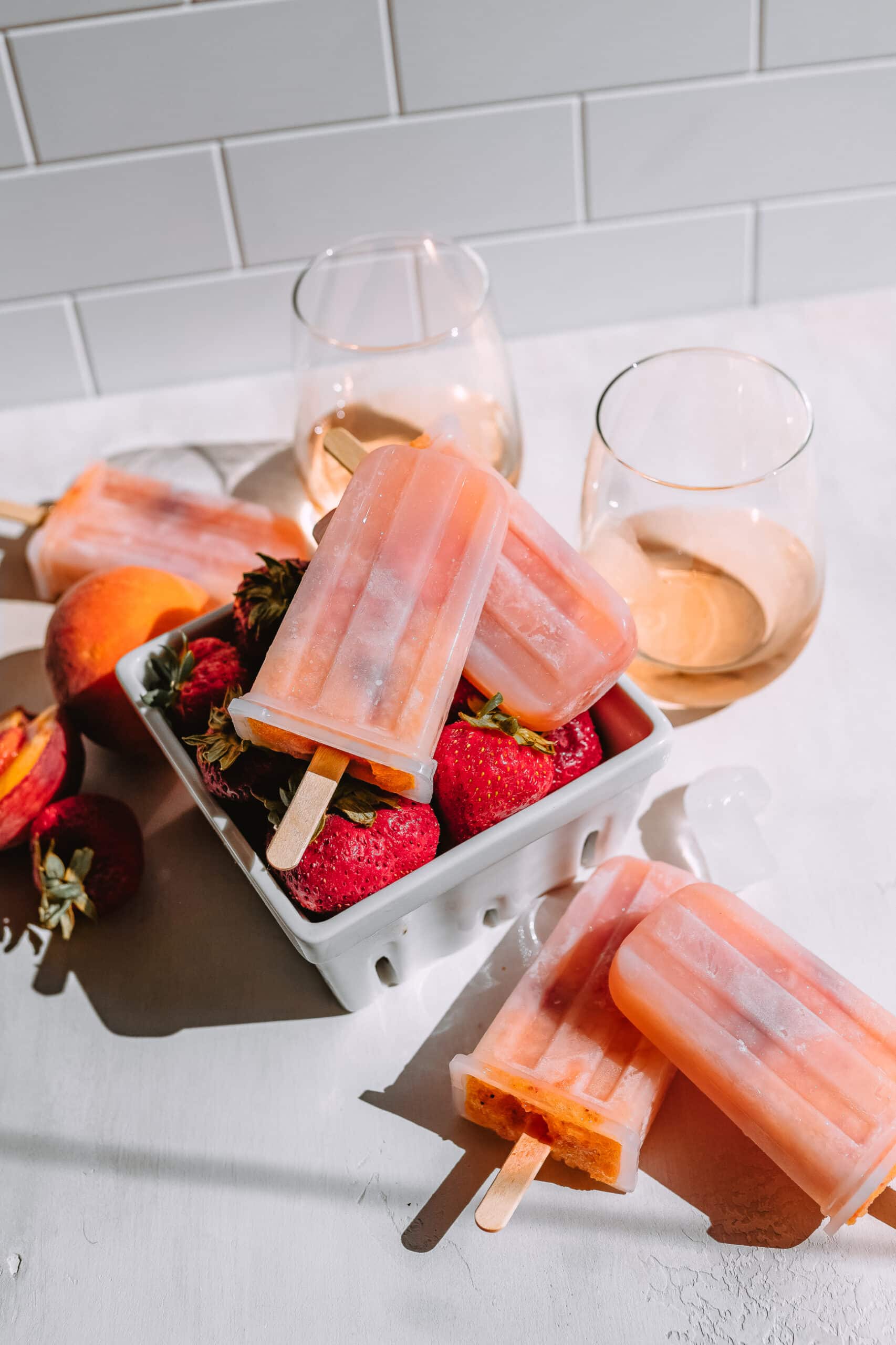 Peach and Strawberry Rose Popsicles, Rosé popsicles, boozy popsicles | Charmed by Camille