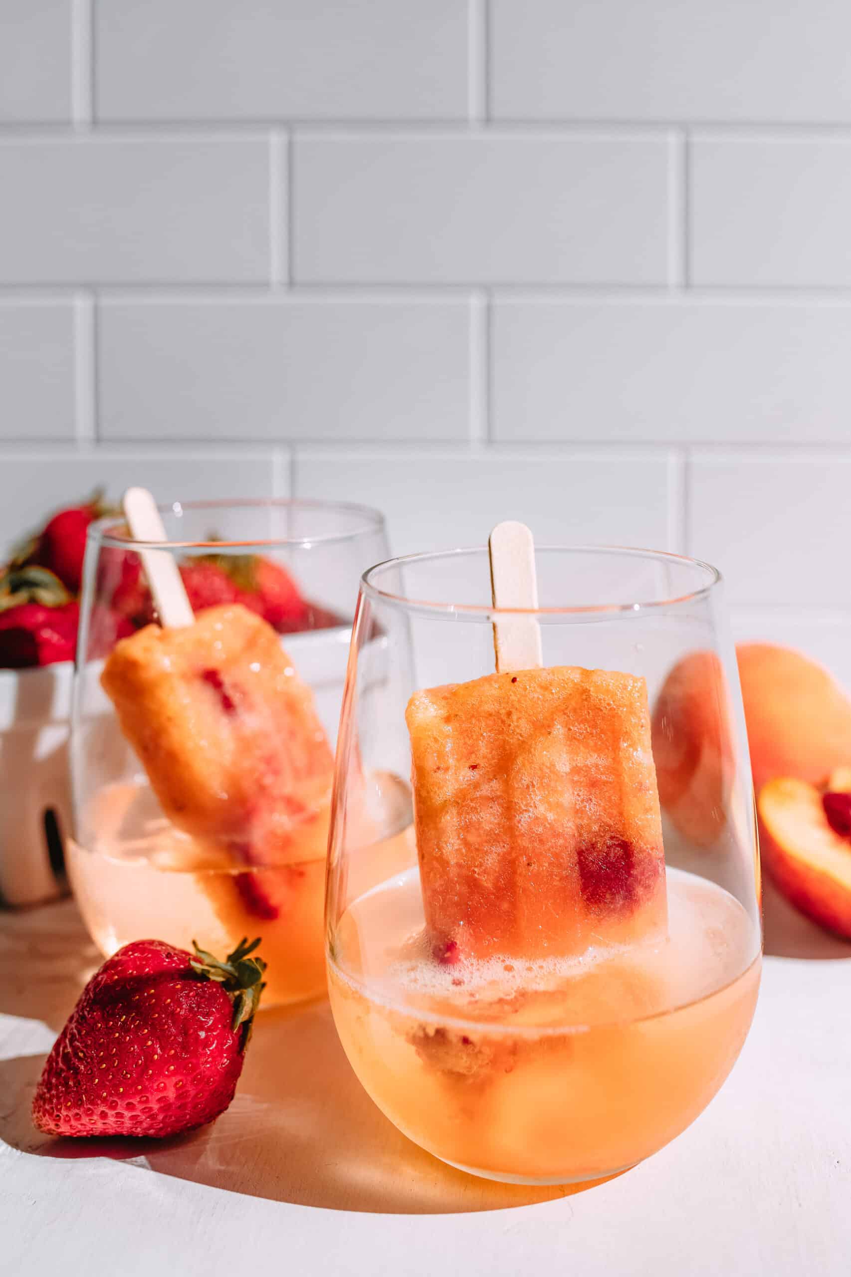 Peach and Strawberry Rose Popsicles, Rosé popsicles, boozy popsicles | Charmed by Camille