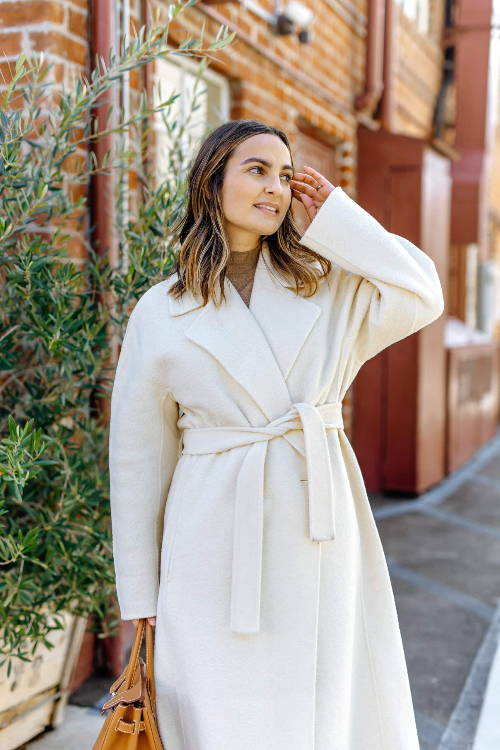 white coat winter fashion Camille wearing Maje coat
