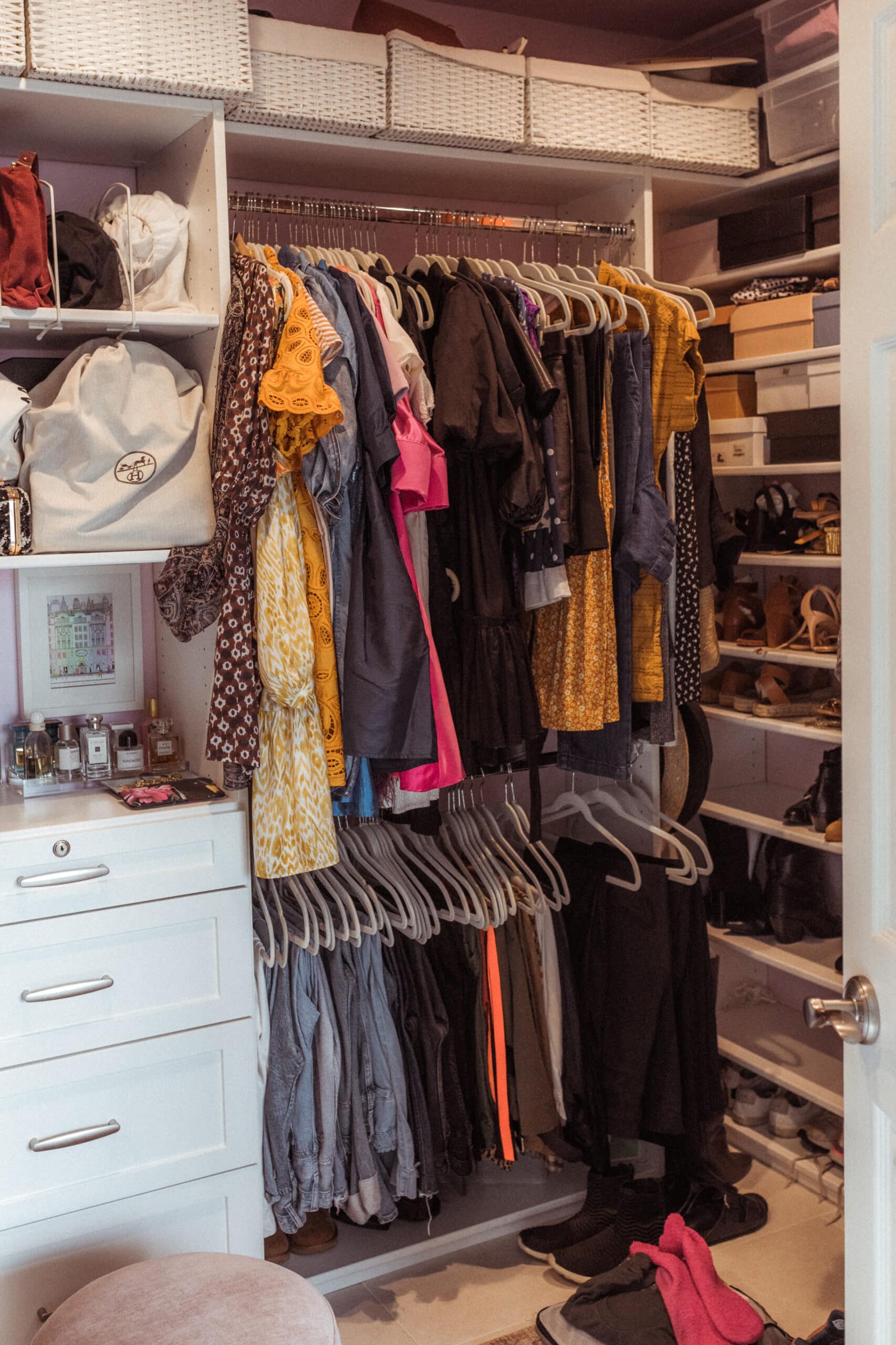 clothes hanging before the Marie Kondo Closet Cleanout