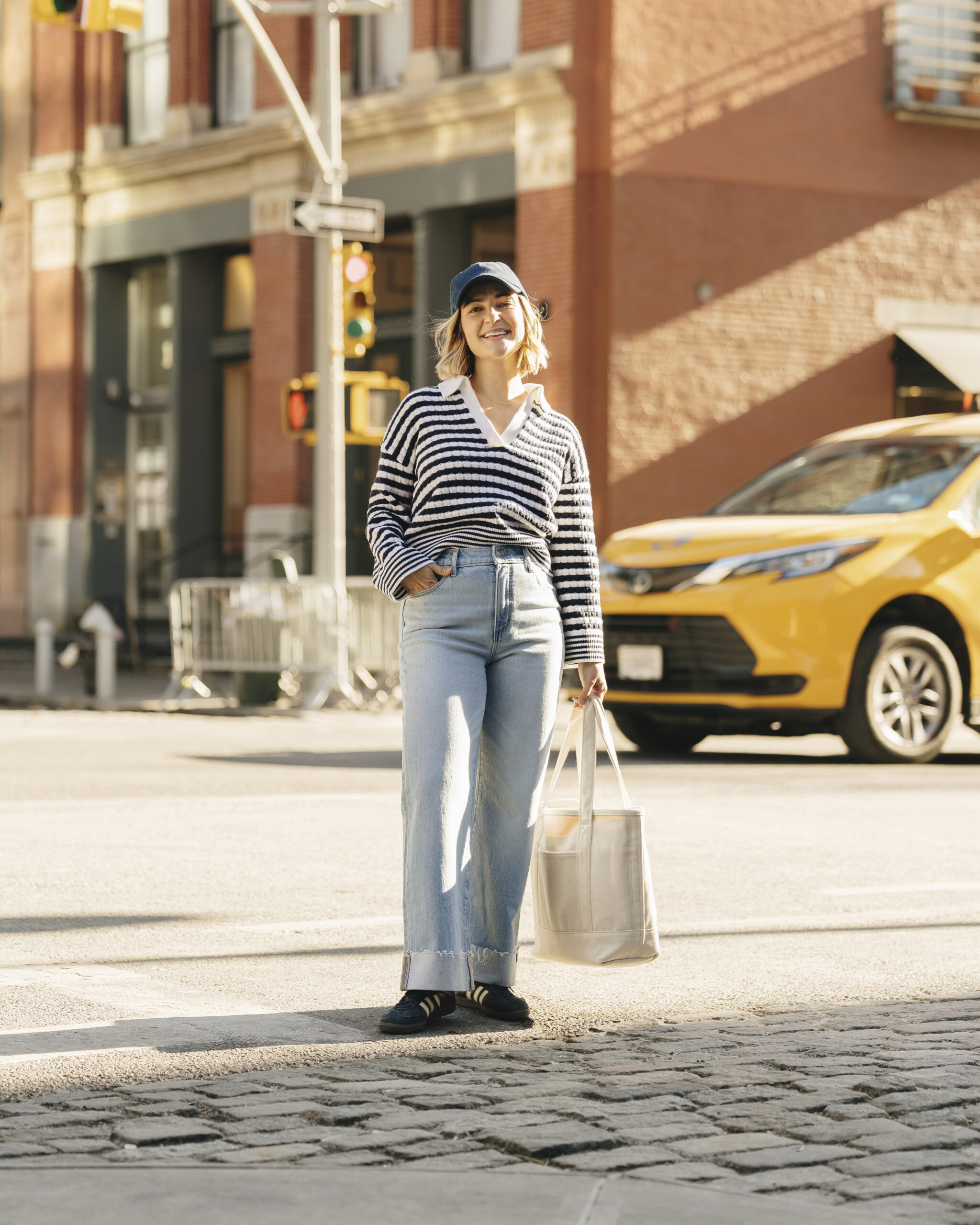 Sneakers walking on busy New York sidewalks.